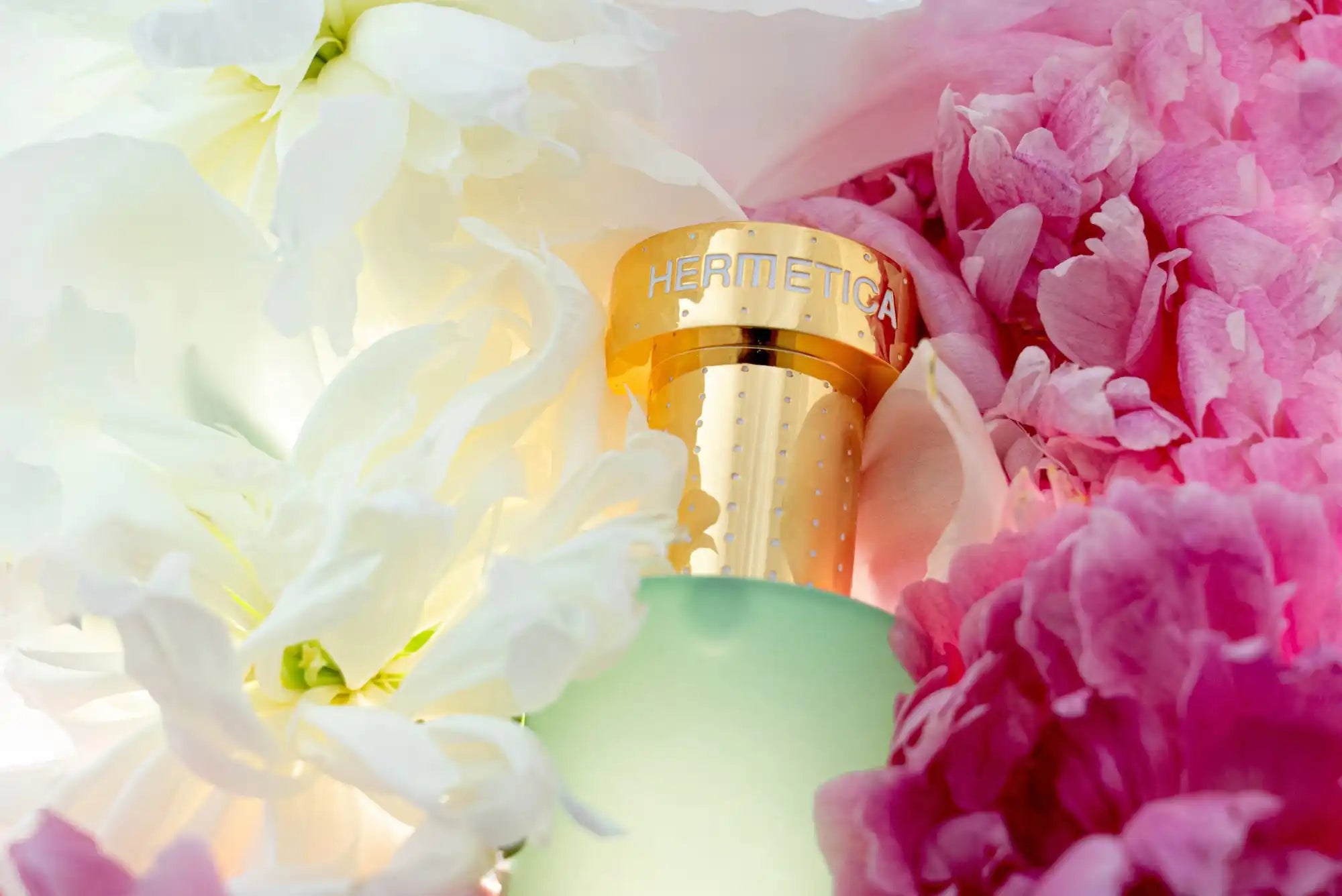 Gold-capped perfume bottle with seafoam green glass.