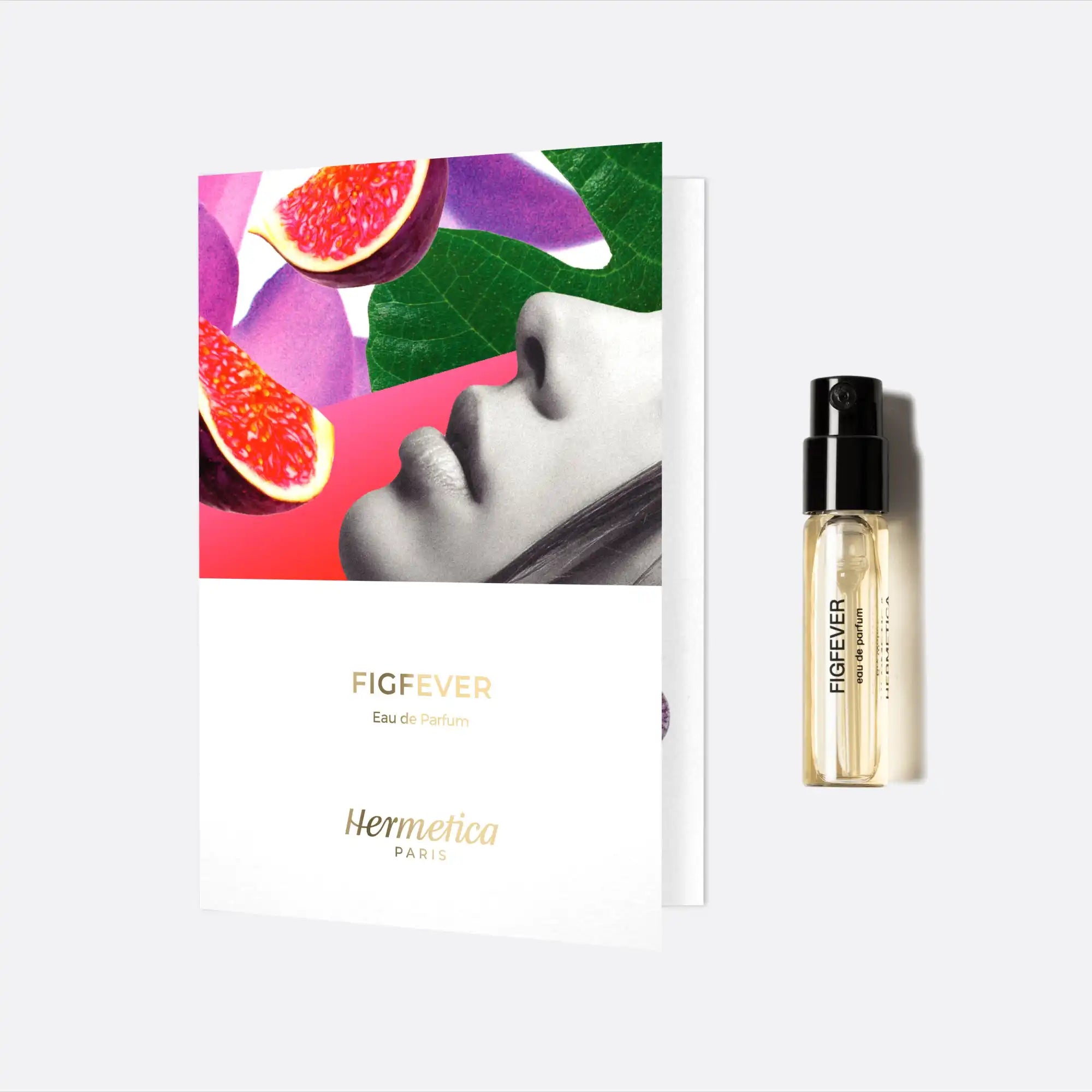 Perfume sample vial with a colorful fig-themed promotional card.