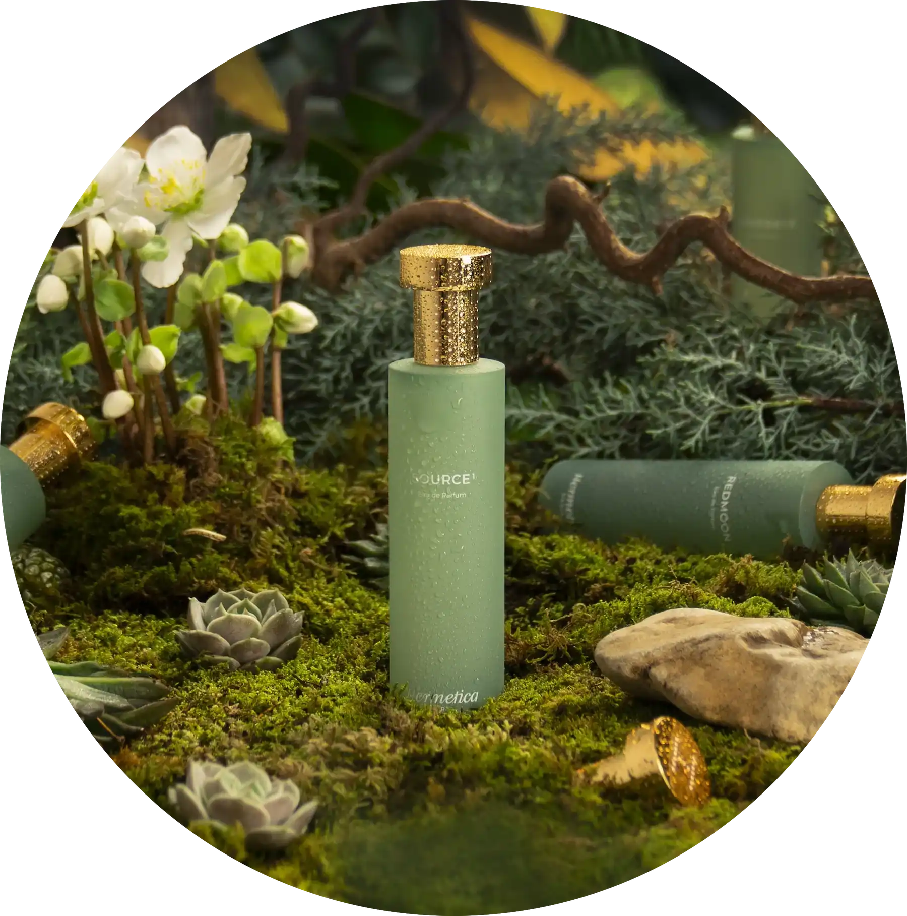 Sage green glass bottle with a gold metallic cap.